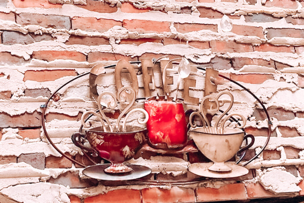 Sign on a wall of Rude Awakening Coffee House, one of the best coffee shops in Fayetteville